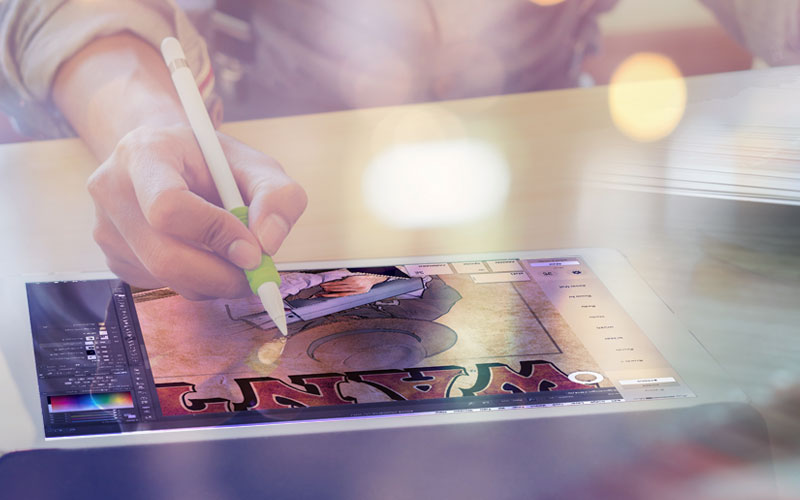 photo of illustrator working on an ipad